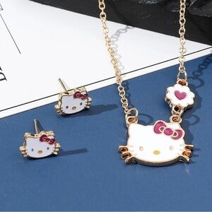 Hello Kitty Head Rhodium Plated Gold Tone Necklace and Earrings Set